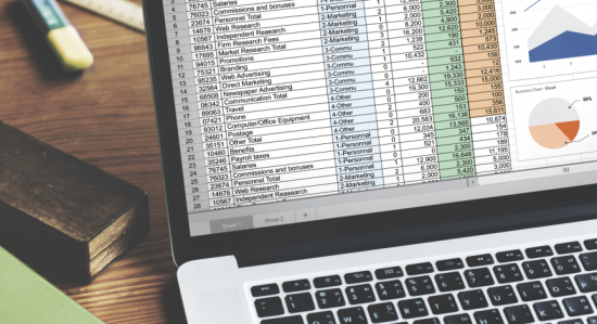 closeup hands using computer laptop with screen showing analysis data min 1 550x299 -