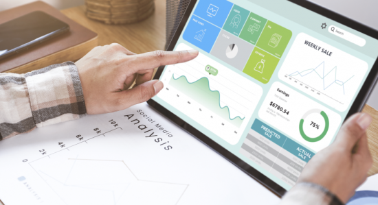 businesswoman using tablet analysis graph company finance s min 1 550x299 -